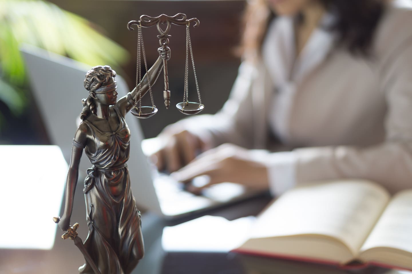 statue of woman holding legal weights